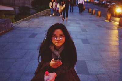 Portrait of a smiling young woman eating food