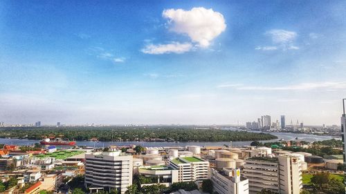 High angle view of buildings in city against sky