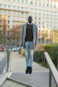 Businessman levitating in office park