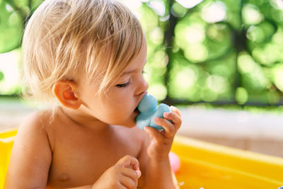 Close-up of boy looking at camera