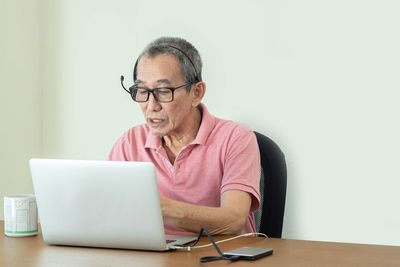 Man using laptop on table