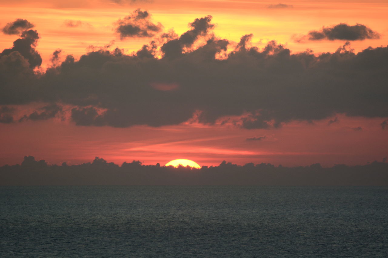 SCENIC VIEW OF SEA AGAINST ORANGE SKY