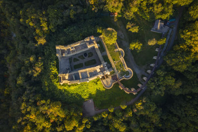 High angle view of house amidst trees and building