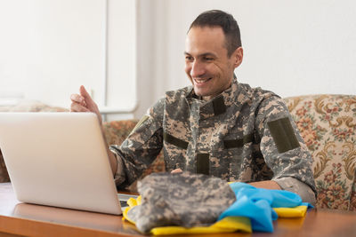 Young man using laptop at home