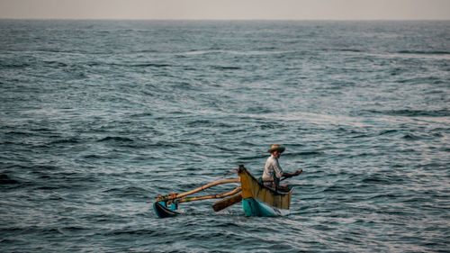 Man sailing in sea