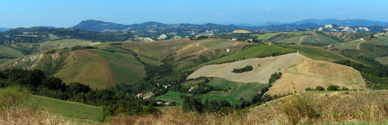 Scenic view of landscape and mountains against sky