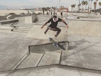 Full length of man skateboarding on skateboard