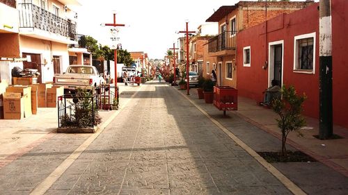 Narrow street leading towards buildings