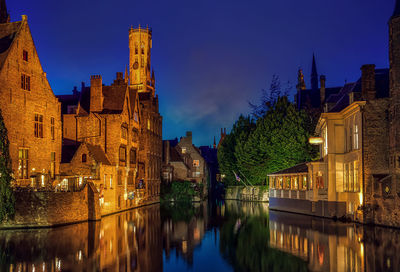 Bruges, belgium. the rozenhoedkaai in bruges with the belfry in the background.