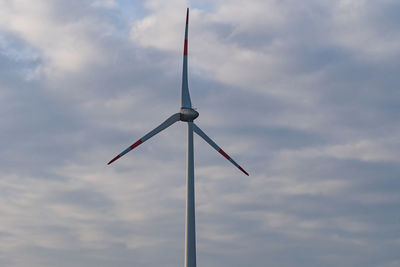 Low angle view of wind turbine against sky