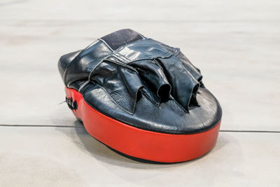 Close-up of boxing glove on table