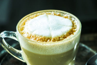 Close-up of cappuccino on table