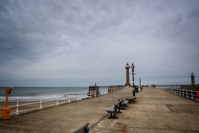 Pier over sea against sky