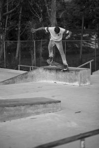 Full length of man skateboarding in park