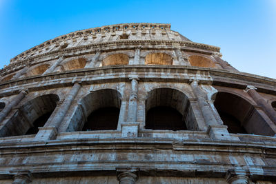 Low angle view of arched structure against clear sky