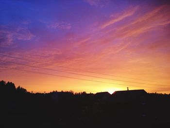 Scenic view of silhouette landscape against sky at sunset