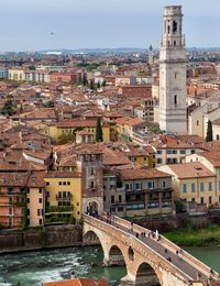 Bridge over canal with buildings in city