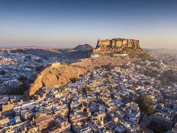Aerial view of townscape against sky