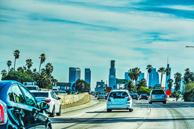 Cars on road against sky