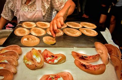 High angle view of person preparing food on table