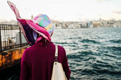 Rear view of woman standing against sea bosphorus sea turkey istanbul