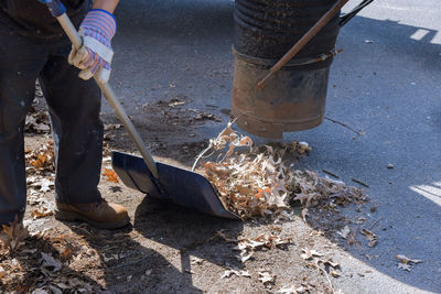Low section of man working on street