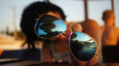 Reflection of sunglasses on glass