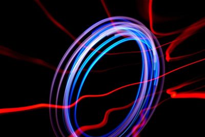 Abstract light painting against black background