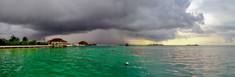 Scenic view of sea against cloudy sky