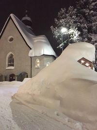 Illuminated built structure in winter at night