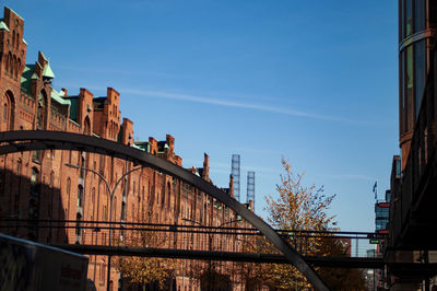 Bridge and buildings against sky