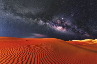 Scenic view of desert against sky at night