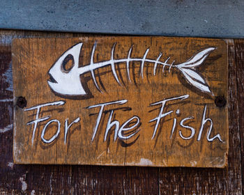 Text written on wooden plank