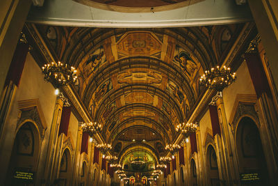 Low angle view of illuminated chandelier in building