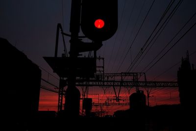 Low angle view of electricity pylon against sky