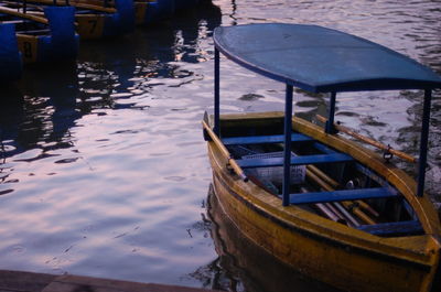 Boats moored in water