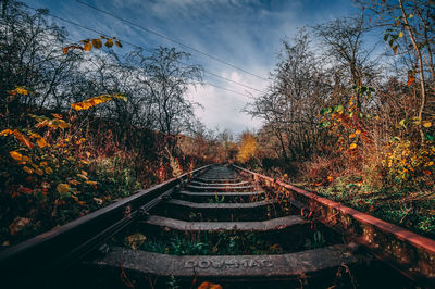 Railroad tracks against sky during autumn