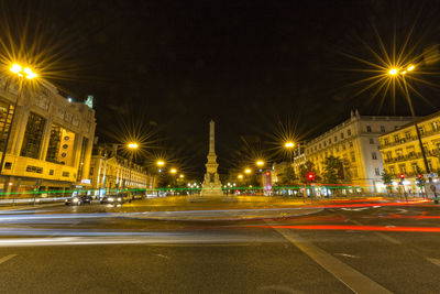 Light trails on city street at night