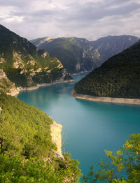 Turquoise water of piva lake, pivsko jezero, in the mountains, in durmitor national park, montenegro