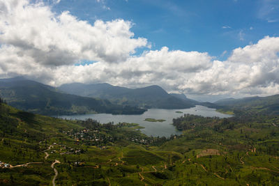Aerial view of lake in a mountainous area among tea plantations. maskeliya, castlereigh, sri lanka.