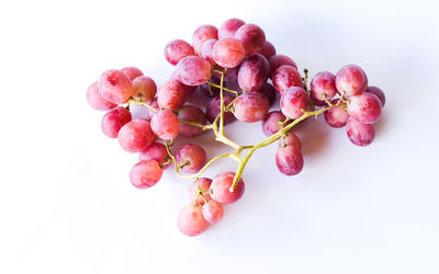 Close-up of grapes against white background