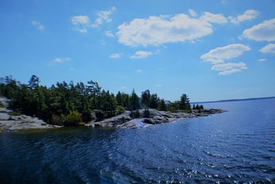 Scenic view of sea against blue sky