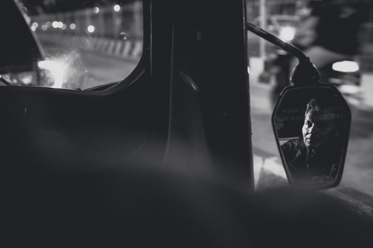 mode of transportation, transportation, glass - material, vehicle interior, car, land vehicle, transparent, motor vehicle, window, day, travel, real people, incidental people, public transportation, close-up, outdoors, selective focus, car interior, reflection, focus on foreground