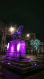 Low angle view of illuminated street light at night