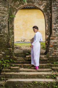 Beautiful woman exploring the imperial palace in hue / vietnam