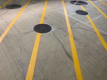 High angle view of manholes on road