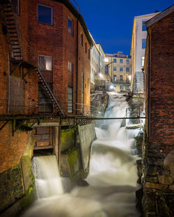 Water flowing in city during winter