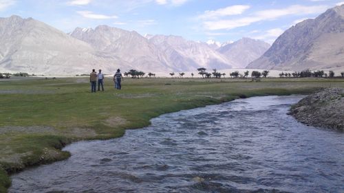 Scenic view of landscape and mountains against sky