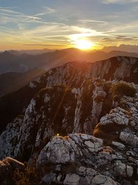 Scenic view of mountains against sky during sunset