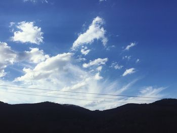 Low angle view of silhouette mountain against sky